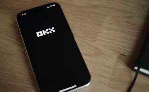 OKX logo on iphone screen